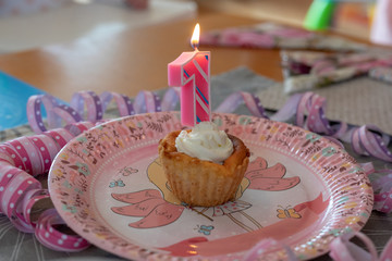 Number 1 birthday candle in a cupcake
