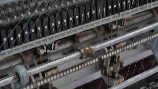 Production of mattress cover. Textile industry. Close up on loom