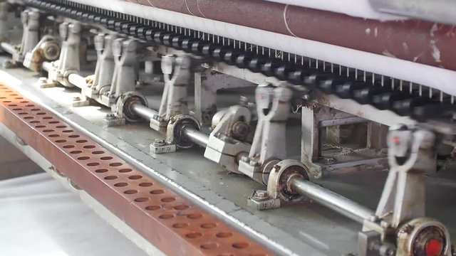 Loom machine detail in motion. Weaving industry