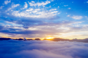 Beautiful sunrise sky with misty above mountain