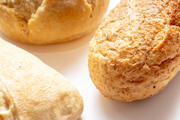 Assortment, different kind of wheat baked bread with golden crust on the table