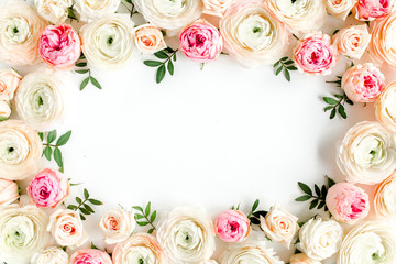 Obraz na płótnie Canvas Floral pattern frame made of pink ranunculus and roses flower buds on white background. Flat lay, top view floral background.