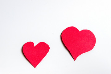 Handmade paper red hearts isolated on white background