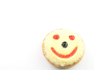 Yellow cream donut, red smile face isolated on white background