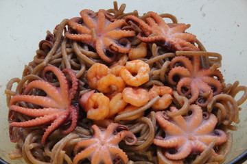 Seafood and noodles. Shrimps, octopus and buckwheat noodles.