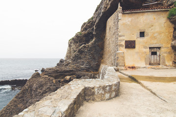 hermitage on the edge of the cliff on the coast