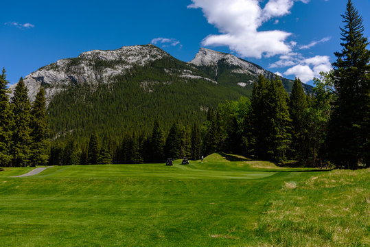 Banff Golf Course and view of rocky mountain range in summer with blue sky in summer , Alberta, Canada