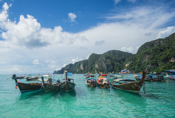 Fototapeta na wymiar Touring around the iconic Phi Phi Islands and the Bamboo island national park. In those places you can find the most beautiful beaches in Thailand with Crystal clear water and white sand. 