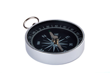 Detailed view of a magnetic compass silver and black, isolated on white background.