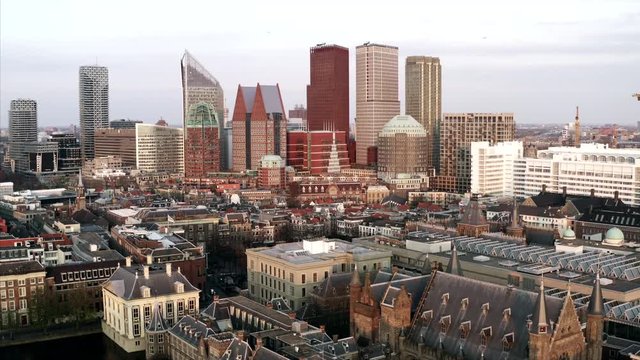 The cityscape of Den Haag in an aerial shot. The drone sinks into the Binnenhof.