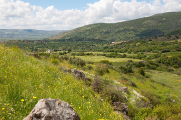 Fototapeta na wymiar Sa'ar waterfall and the Golan Heights