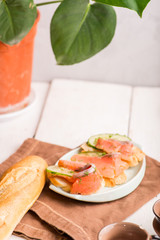 piece of salmon fillet on bread. Breakfast with sandwich with fish