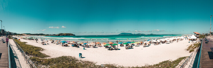 Fototapeta na wymiar beach with chairs and umbrellas view from the sidewalk