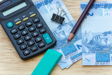 calculator and money to calculate the economy.