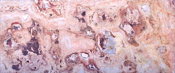 Naklejka premium Maroccan marble, known for containing a large number of petrified prehistoric fossil animals and mollusks