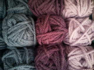 Skeins with different colors of threads for knitting, for needlework