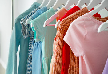 Hangers with female clothes, closeup