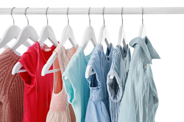 Rack with stylish female clothes on white background