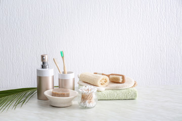 Fototapeta na wymiar Natural bath accessories on table against light background. Zero waste concept