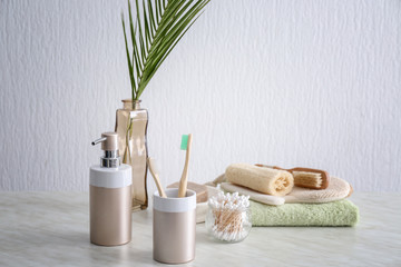 Natural bath accessories on table against light background. Zero waste concept