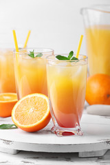 Glasses of tasty Tequila Sunrise cocktail on table