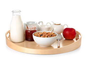 Tray with tasty breakfast on white background