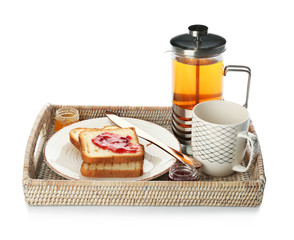 Tray with tasty breakfast on white background