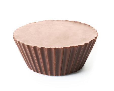 Tasty chocolate peanut butter cup on white background