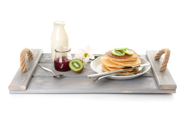 Tray with tasty breakfast on white background