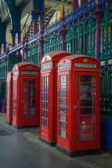 Fototapeta premium Traditional bristish phoneboxes in a viktorian market hall.