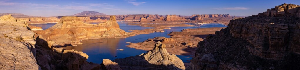 Fototapeta na wymiar Lake Powell Arizona and Utah USA. Sweeping panoramic vista of Scenic Lake Powell from above the buttes and water at sunset near Page AZ.