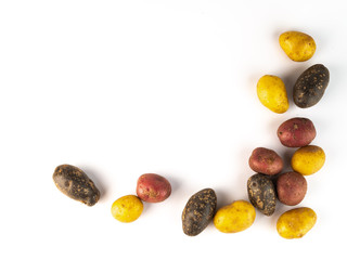 Mixed varieties of potatoes: red potatoes, yellow potatoes and purple potatoes