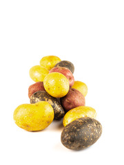 Mixed varieties of potatoes: red potatoes, yellow potatoes and purple potatoes