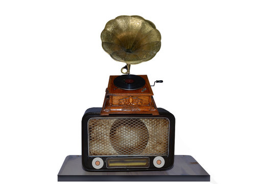 Old turntable on an old radio all over a white background