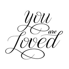 You are loved. Elegant romantic calligraphy. Vector design element for greeting cards. Black isolated cursive. Calligraphic style. Hand writing script. Handwritten phrase. 