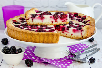 Blackberry sour cream pie - homemade tart summer pie with ripe blackberries berry and sour cream sweet filling on crispy thin dough