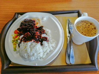 A lunch set, fried pork chop with rice in black pepper sauce, in a Hongkongese chain restaurant