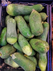 Bulk green radish in the box in a grocery store
