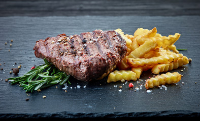 grilled beef fillet steak and fried potatoes