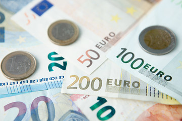 Euro banknotes and coins background . Money and finances concept.