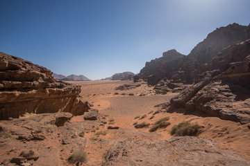 Fototapeta premium A beautiful day in the Jordanian desert of Wadi Rum. wide dessert with an amazing mountains and sand dunes , amazing scenery that you should see ! 