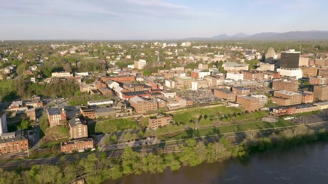The James River Flows Quietly by Downtown City Skyline and Buildings of Lynchburg Virginia