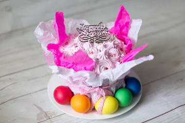 cake. the Easter cake and colored eggs. topper with inscription in Russian "Christ is risen"