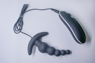 Bright sex toys on white background in the studio 