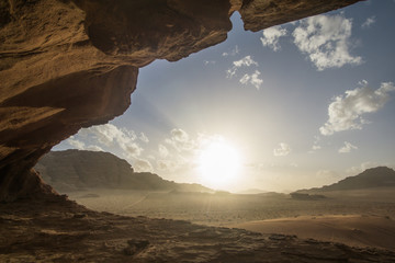 Amazing sunset at the Jordanian desert of Wadi Rum ,this breathtaking sunset will really blow your mind. Its stunning to see how the sun disappearing slowly behind those iconic mountains.