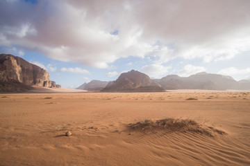 A beautiful day in the Jordanian desert of Wadi Rum. wide dessert with an amazing mountains and sand dunes , amazing scenery that you should see ! 