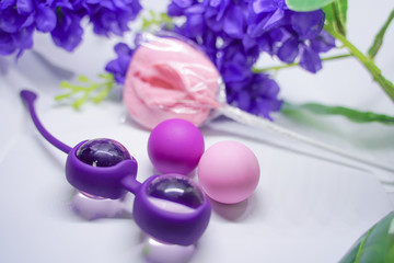 Bright sex toys on white background in the studio 