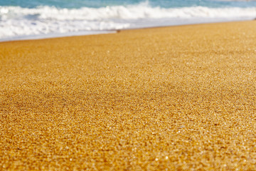 Fototapeta na wymiar beach with golden sand and blue ocean water