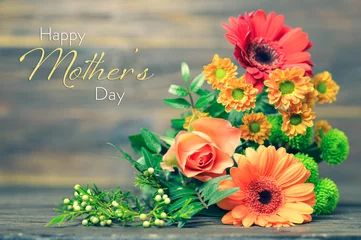 Foto op Canvas Happy Mothers Day card with flowers on wooden background © izzzy71