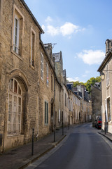 Fototapeta na wymiar The ancient street with typical houses of an medieval city Bayeux. Calvados department, Normandy, France
